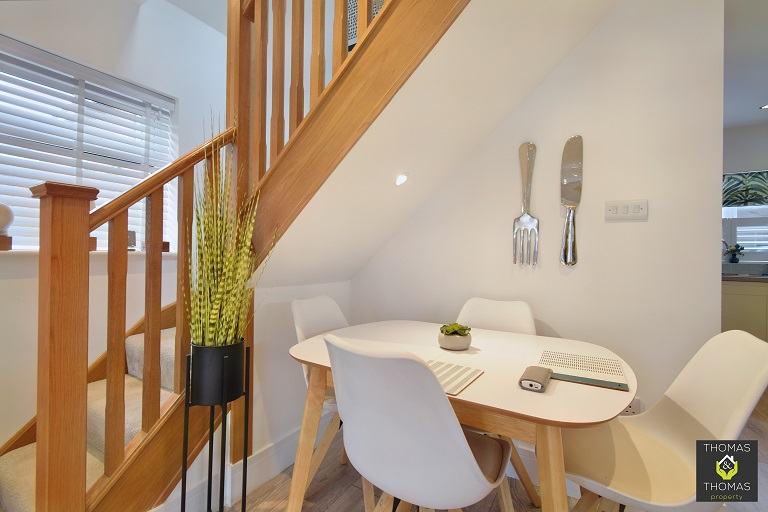 The understairs dining table with brightness, contrast and colour corrected and looking attractive and professional